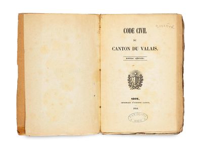 an open book with a picture of a coat of arms on it