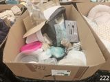 a box full of baby items sitting on a table