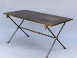 a black and gold coffee table with two legs and a black top