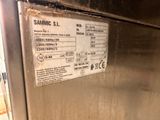 a close up of a stainless steel refrigerator with a label on it