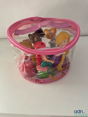 a plastic bag filled with small toys on a table