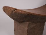 a wooden bench that is sitting on a white surface