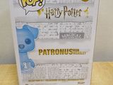 a box of harry potter with a blue teddy bear on it