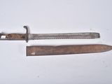 a knife and a knife blade on a white surface