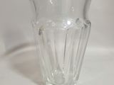 a glass cup that is sitting on a table