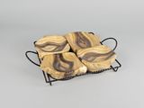 marbled soap bars in a wire basket on a gray background