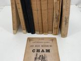 several old books sitting on top of each other on a table