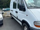 a white van that is parked in a parking lot