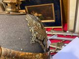 a hat with a dragon on it sitting on a table