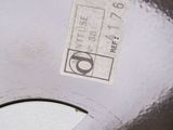 a close up of a parking meter with a sticker on it