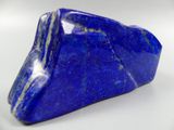 a close up of a blue stone on a white surface