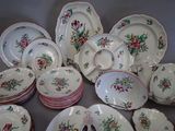 a lot of plates and bowls that are sitting on a table