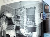 an open book with a picture of a bedroom in it