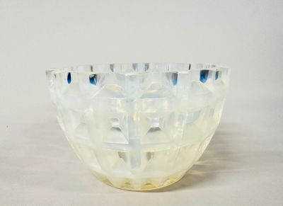 a glass bowl that is sitting on a table
