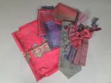 many different types of ties laid out on a table