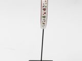 an image of a sculpture of a woman ' s head on a black stand