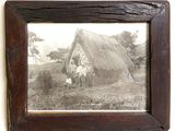 a picture of an old picture hanging on the wall
