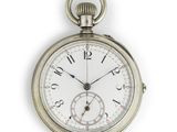 a close up of a pocket watch on a white background