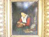un tableau représentant une femme tenant un panier, dans un cadre doré