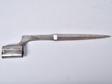 a knife that is laying on a white surface