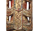 an image of a wooden sculpture of a woman on a pedestal