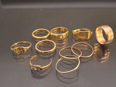 a lot of gold rings sitting on a table