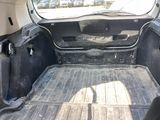 the back of a truck with a flat bed in the back of it