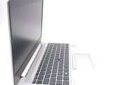 a laptop computer sitting on top of a white table