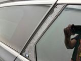 a man that is taking a picture of himself in a car