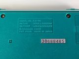 a blue electronic device that is sitting on a table