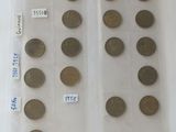 a lot of coins in a plastic bag on a table