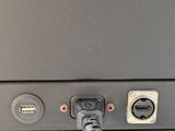 a close up view of a tv with a cable plugged into it