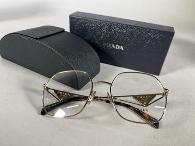 prada eyeglasses with case and box on white surface