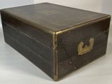 a small wooden box with a chain around it