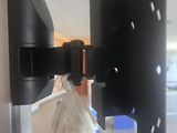 an image of a tv wall mount with a bag of garbage
