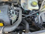 a close up of a car ' s engine with its hood open