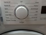 a close up of a washing machine with the controls on