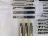 many different types of drill bits in a plastic box