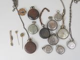 many different types of pocket watches on the table
