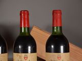 three bottles of wine sitting next to each other on a table