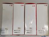 three boxes of white and red electronic devices sitting on top of a table