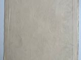 an old piece of paper taped to a wall with a piece of tape on it
