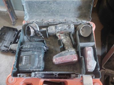 a tool case with tools in it on the floor