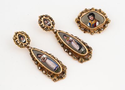 three pairs of antique gold - plated earrings with a picture of a man and woman