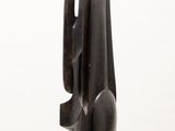 sculpture of a black sculpture on a white pedestal against a white background