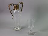 two vases and a wine glass on a table