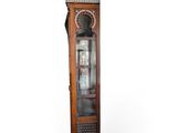 a grandfather clock that is on display in the room