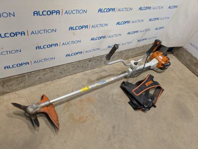 a picture of a lawn mower that is laying on the ground
