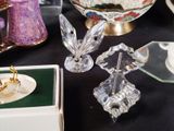 a lot of glass figurines sitting on a table
