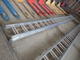 many different types of ladders lined up on the ground
